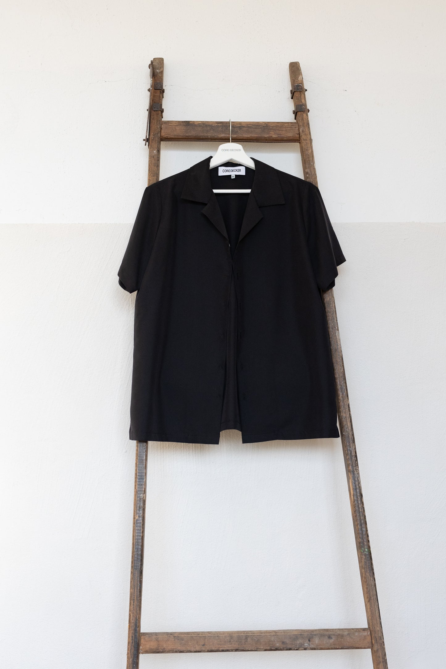 Women's black shirt with short sleeves